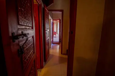 a hallway with an open door to a room at La Ferme de LallaDom in Tameslouht