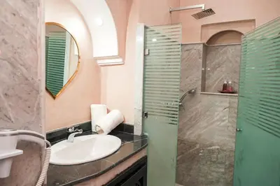 a bathroom with a sink and a shower at Riad Roummana Marrakech in Marrakech