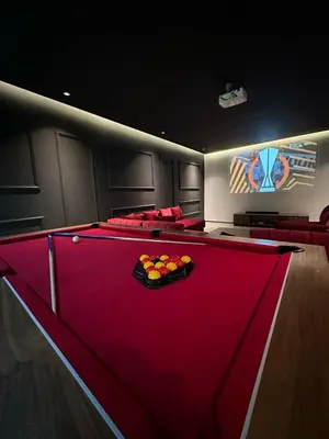 a billiard room with a red pool table at magnifique villa golf amelkis sans vis-à-vis in Marrakech