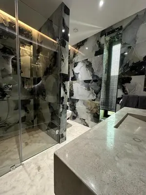a bathroom with a glass shower and a counter at magnifique villa golf amelkis sans vis-à-vis in Marrakech