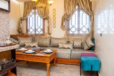 a living room with a couch and a table at Tibouda House Deluxe Avec Piscine - Familiale in Marrakech