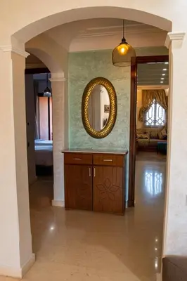 a hallway of a home with a mirror at Tibouda House Deluxe Avec Piscine - Familiale in Marrakech