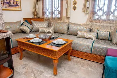 a living room with a couch and a table at Tibouda House Deluxe Avec Piscine - Familiale in Marrakech