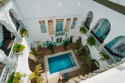 an aerial view of a villa with a swimming pool at Riad Assouel et Spa By La Siredrah in Marrakech