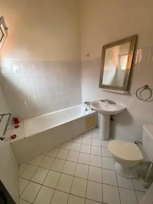 a bathroom with a tub and a toilet and a sink at Riad Ayiss piscine palmeraie in Marrakech