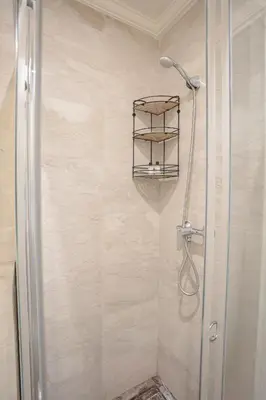 a shower in a bathroom with a glass door at The Vogue – Marrakech Centre in Marrakech