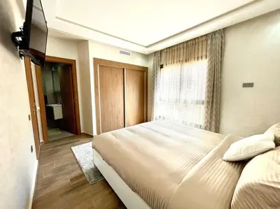 a bedroom with a large bed and a window at Menara Garden pool in Marrakech