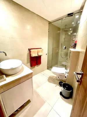 a bathroom with a sink and a toilet and a shower at Menara Garden pool in Marrakech