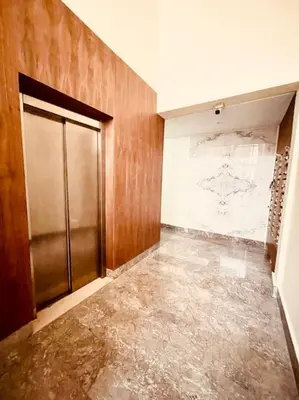 an empty room with a door and a wall at Menara Garden pool in Marrakech