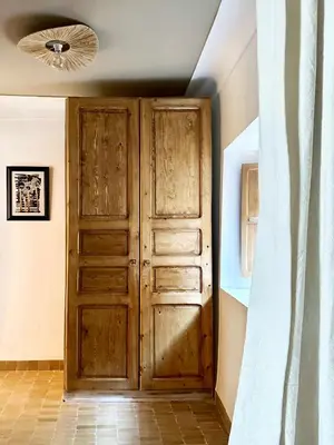 a wooden door in a room with a ceiling at Riad de l'Ô with Pool, Rooftop, Free Breakfast in Marrakech