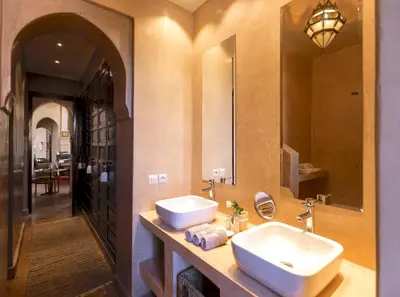 a bathroom with a sink and a mirror at Palais Sena in Marrakech