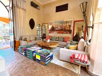 a living room with a couch and a table at Palais Sena in Marrakech