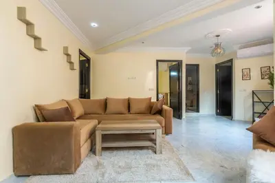 a living room with a couch and a coffee table at Appartement Unique au Centre in Marrakech