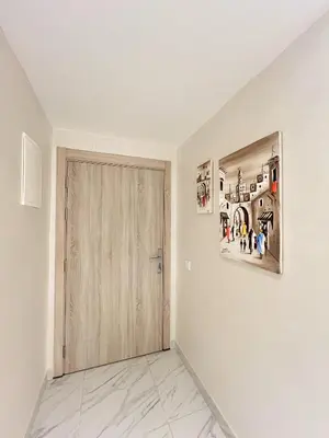 a room with a door and paintings on the wall at Condo in marrakech with pool in Marrakech