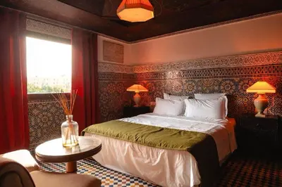 a bedroom with a large bed in a room at LUXURY apartment in Marrakech