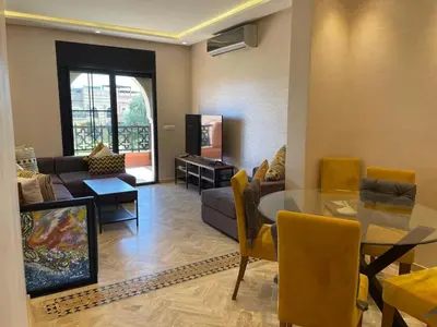 a living room with a glass table and a couch at Strasmarrakech in Marrakech