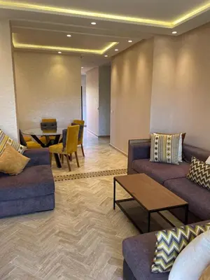 a lobby with couches and a table and a dining room at Strasmarrakech in Marrakech