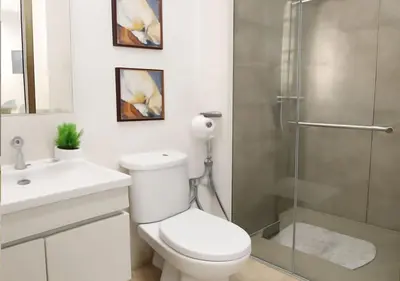 a bathroom with a toilet and a glass shower at Appart vacance safaa in Marrakech