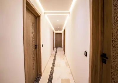 a corridor of a corridor of a building with a hallway at Appart vacance safaa in Marrakech