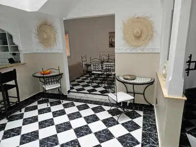a room with a black and white checkered floor at Riad karya MEDINA in Marrakech