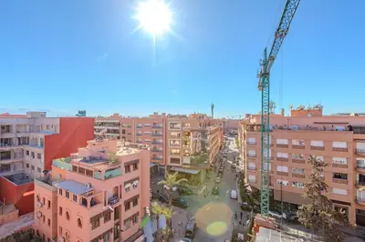 a view of a city with a construction crane at modern friendly appt in gueliz in Marrakech