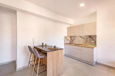 a kitchen with a wooden island in a room at modern friendly appt in gueliz in Marrakech