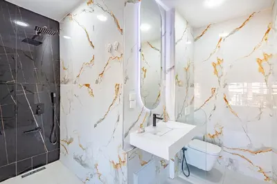 a bathroom with a sink and a shower and a toilet at modern friendly appt in gueliz in Marrakech