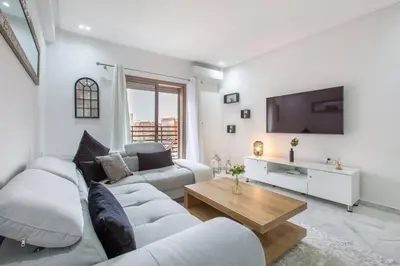 a living room with two couches and a tv at New! Guéliz , Modern , Terrasse in Marrakech