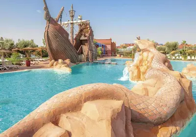 a fake snake in a pool at a resort at Appartement avec Solarium Privé au Vizir Résidence Prestigieuse avec Accès au Parc in Marrakech