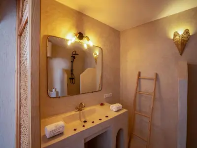 a bathroom with a sink and a mirror at Riad Kilimini & SPA in Marrakech