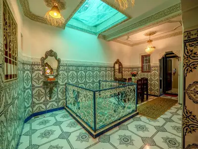 a room with a tile floor and a ceiling at Pretty Apartment in the Medina in Marrakech