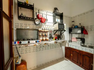 a kitchen with a stove and a counter top at Pretty Apartment in the Medina in Marrakech