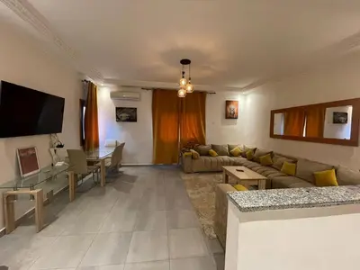 a living room with a couch and a table at Appartements Guéliz Zerktouni in Marrakech