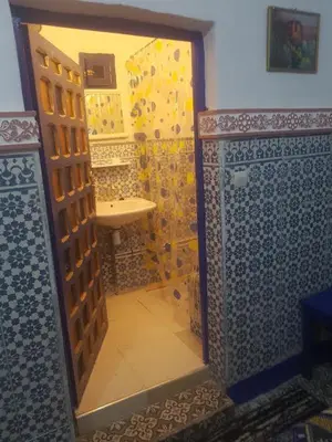 a bathroom with a shower and a sink at Riad dar kader C in Marrakech