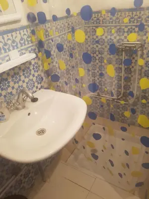 a bathroom with a sink and a shower at Riad dar kader C in Marrakech