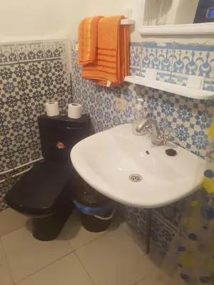 a bathroom with a sink and a toilet at Riad dar kader C in Marrakech
