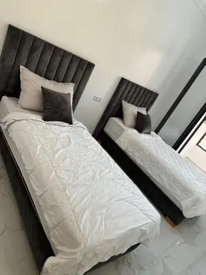 two beds sitting next to each other in a bedroom at Marrakech apartement in Marrakech