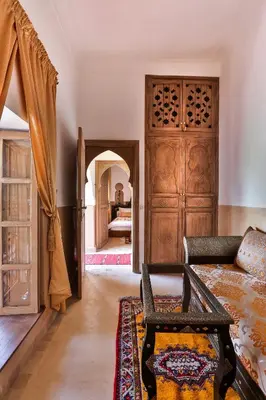 a living room with a couch and a table at Riad Fleur d'Orient in Marrakech