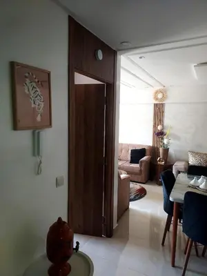 a living room with a door open to a living room at Calista Appart hotel piscine in Marrakech