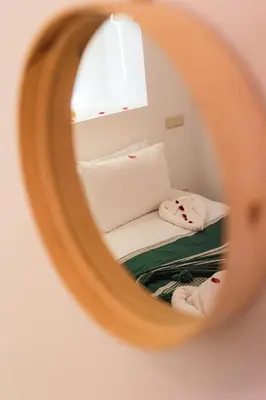 a reflection of a bed in a mirror at Riad Mama in Marrakech