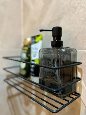 a bottle of soap on a shelf in a bathroom at Yumo: The Cozy One in Marrakech