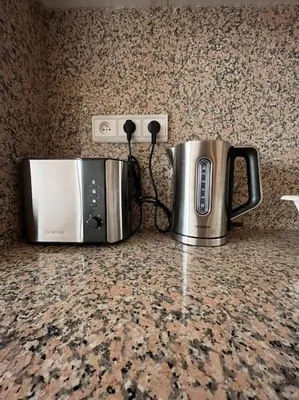 a toaster and a microwave sitting on a counter at Yumo: The Cozy One in Marrakech