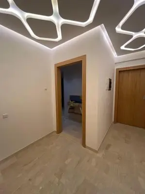 an empty room with a white ceiling and a door at Yumo: The Cozy One in Marrakech