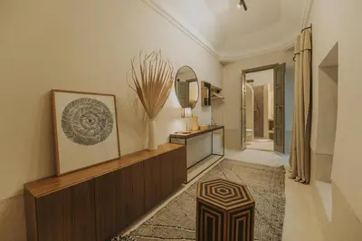 a hallway with a mirror and a dressing room at Riad Dar M in Marrakech