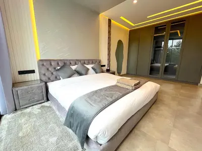 a bedroom with a large bed in a room at Palais Thami in Marrakech