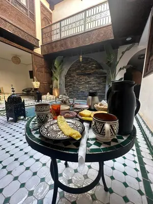 a table with plates of food on top of it at RIAD KS & SPA in Marrakech