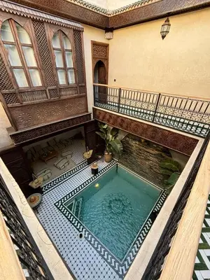 an overhead view of a swimming pool in a building at RIAD KS & SPA in Marrakech