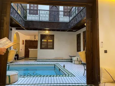 a house with a swimming pool in the middle of a room at RIAD KS & SPA in Marrakech