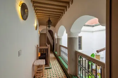 a hallway of a building with a staircase and a staircase at Riad Kiwi - Private Historic Riad Jacuzzi & Hammam - Entire Home in Marrakech