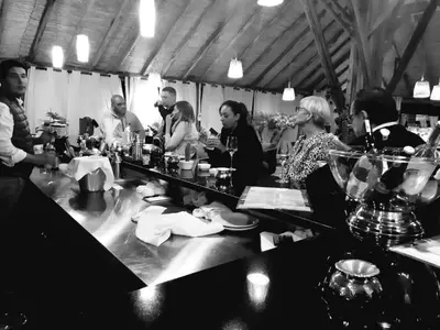 a group of people sitting around a table at THE FARM LODGES & Private pool in Marrakech